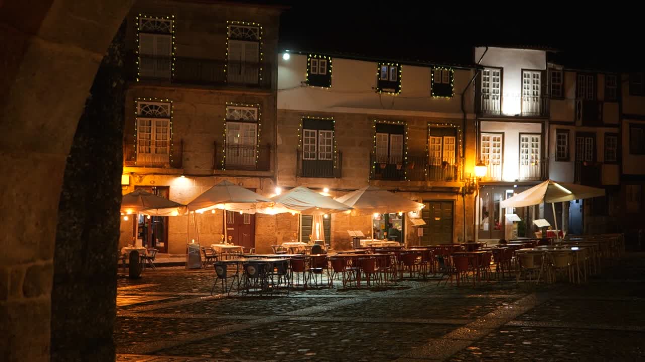 Rainy Christmas Night at Largo da Oliveira, Guimarães ,Historic Church and Festive Lights