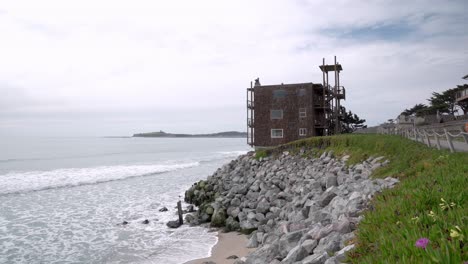 panoramic view of the pillar point and an old hotel by the bay