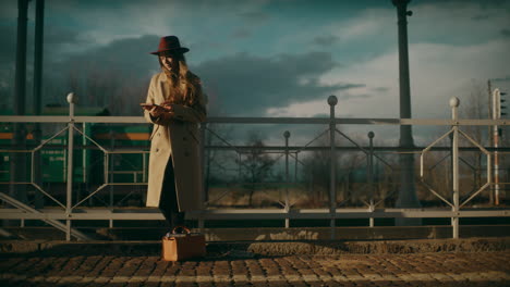 Pensive-Woman-At-Railway-Station