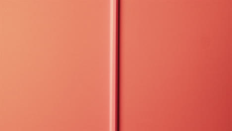 Close-up-of-red-pencil-with-copy-space-on-red-background