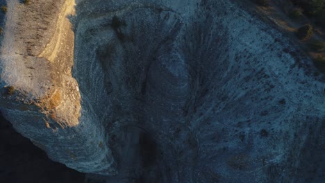 aerial view of a dramatic cliff and valley