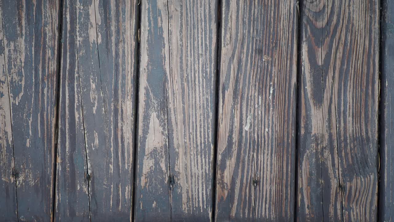 Close-up view of weathered dark wooden planks