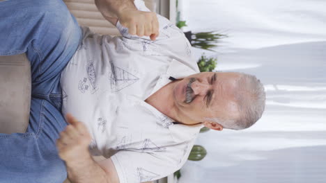 Vertical-video-of-Aggressive-and-neurotic-old-man.