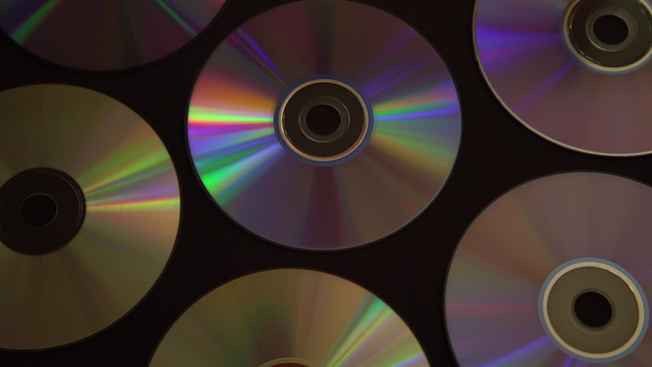 Vintage CD or DVD disk background, old circle discs used for data storage, share movies and music