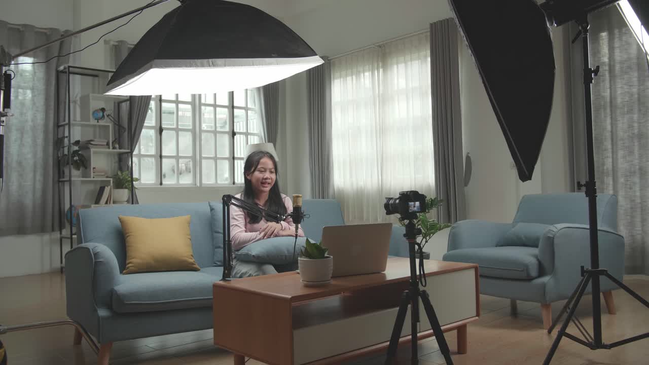 Woman recording a video at home