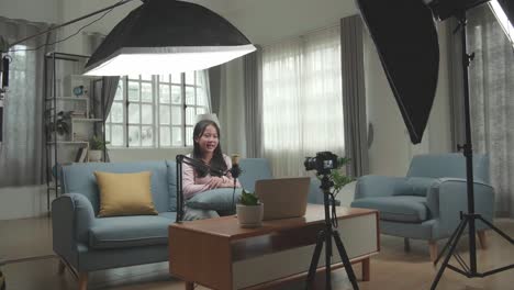 woman recording a video at home