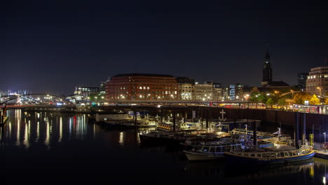 hamburg skyline and boats at night