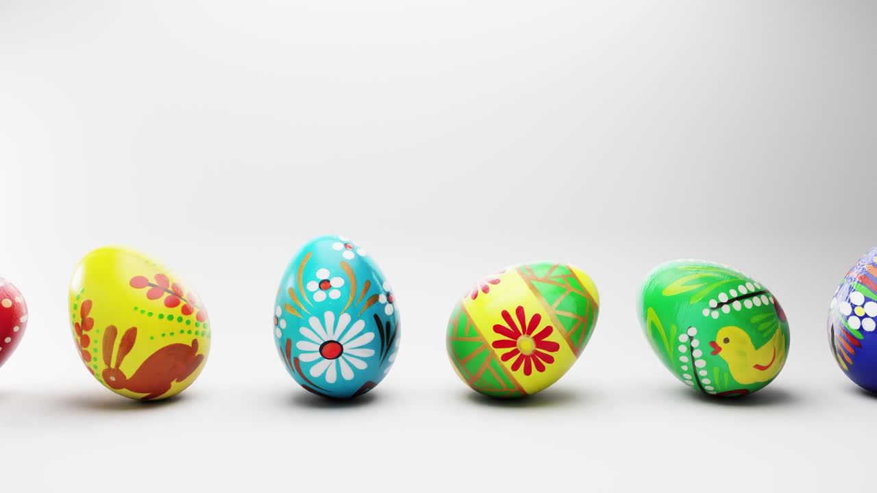 Colorful Painted Easter Eggs Rolling on White Background