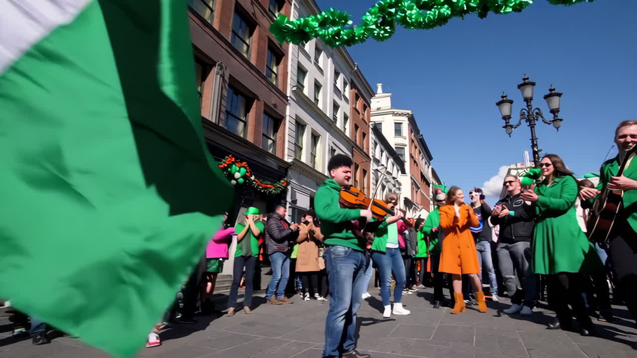 Irish Flag Waves Over a Festive St. Patrick's Day Street Celebration with Live Music