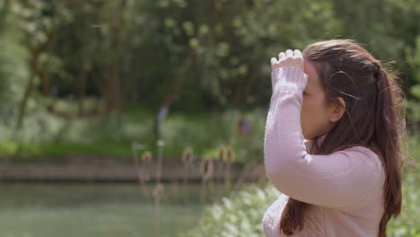 stressed or angry woman outdoors with financial worries about cost of living crisis debt and paying bills holding mobile phone hanging up on call