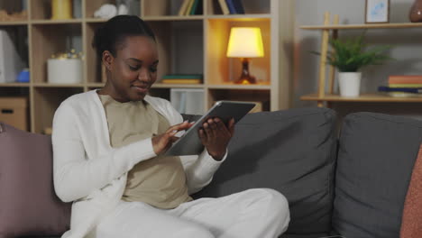 woman using tablet at home