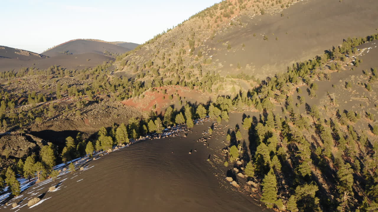 Aerial over majestic dry barren and steep ,Cinder cone volcanic lava mountain on earth
