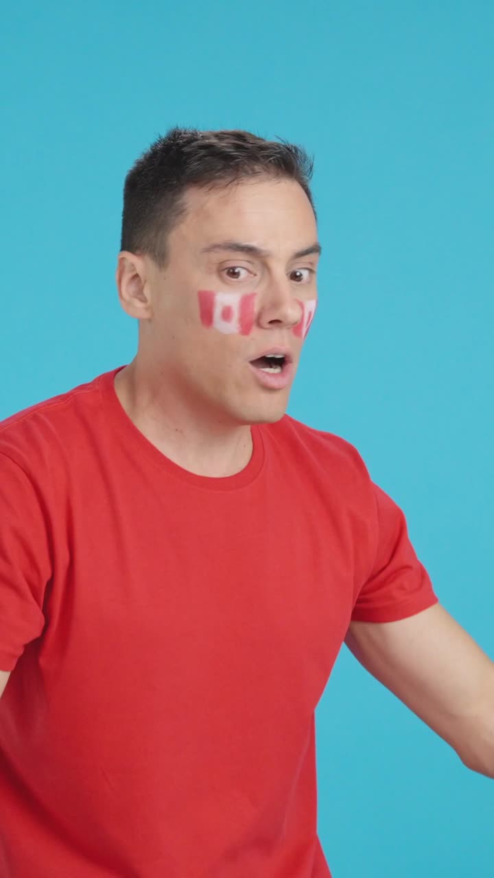 Man cheering for Canada, angry with the decision of referee