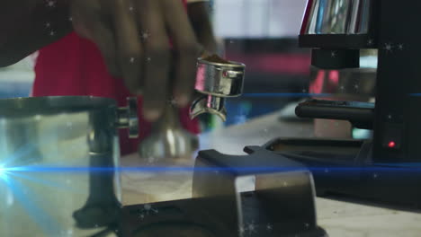 male barista pressing tamper into portafilter on marble bar in cafe, featuring animated snowflakes