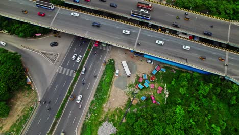 maduravoyal bypass flyover with vehicles, road and trees at ambedkar nagar, kamaraj nagar, chennai bypass road, tamil nadu, india. day time, push down, drone shot, 4k.