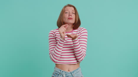 Woman-showing-a-little-bit-gesture-with-sceptic-smile-showing-minimum-sign-measuring-small-size