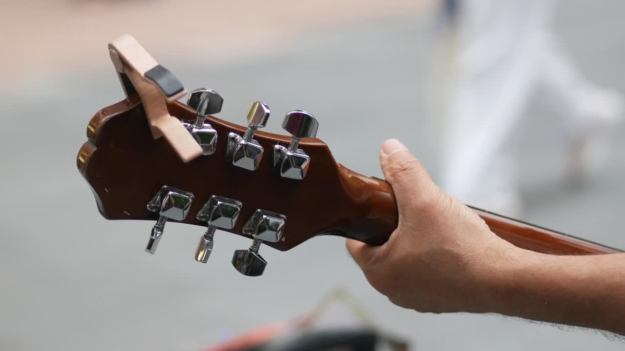 Close up of a person playing an acoustic guitar