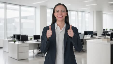 Happy-Indian-female-manager-showing-thumbs-up