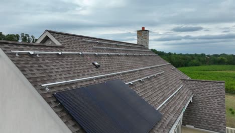 solar panels on shingle roof of house in usa