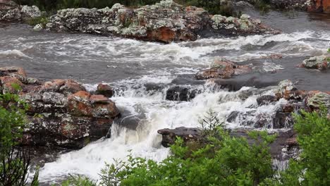 static shot of water flowing from the lisbon river to the lisbon falls