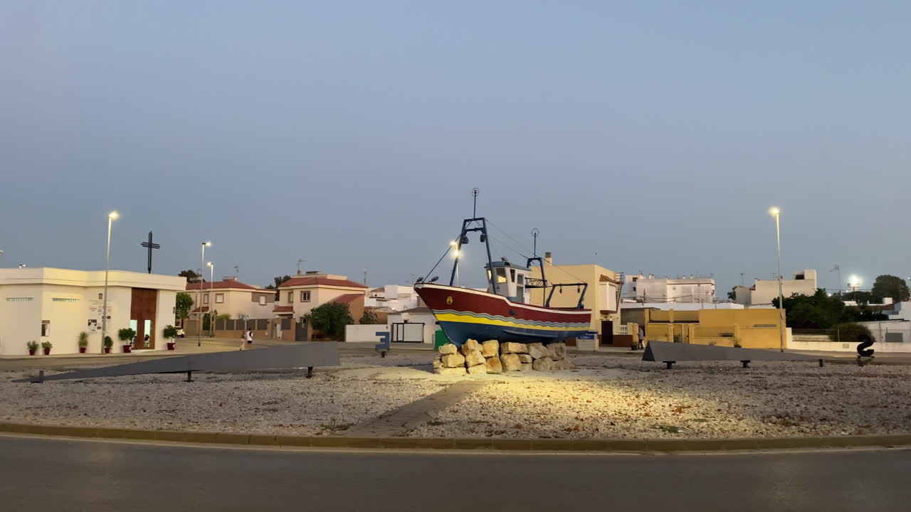 A panoramic view of Sanlúcar’s coastline and fishing boats under a soft morning light