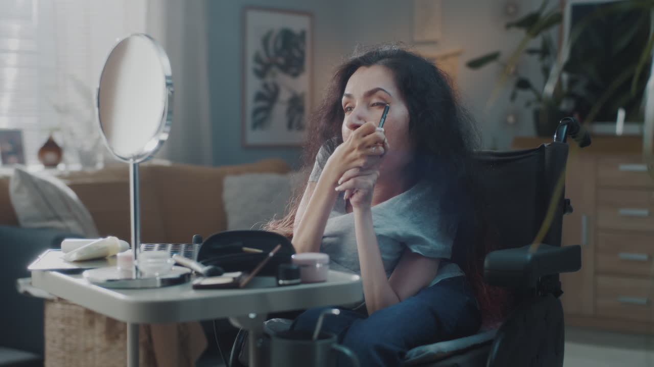 Woman in Wheelchair Applying Makeup