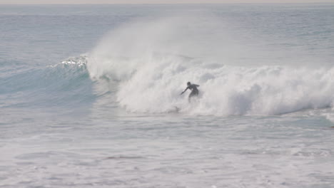 A Surfer crashes and burns while trying to get an aggressive wave in Malibu California