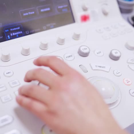 doctor working at ultrasound diagnostic machine