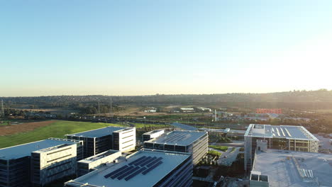 Smooth-reveal-of-modern-business-park-during-perfect-sunset-afternoon