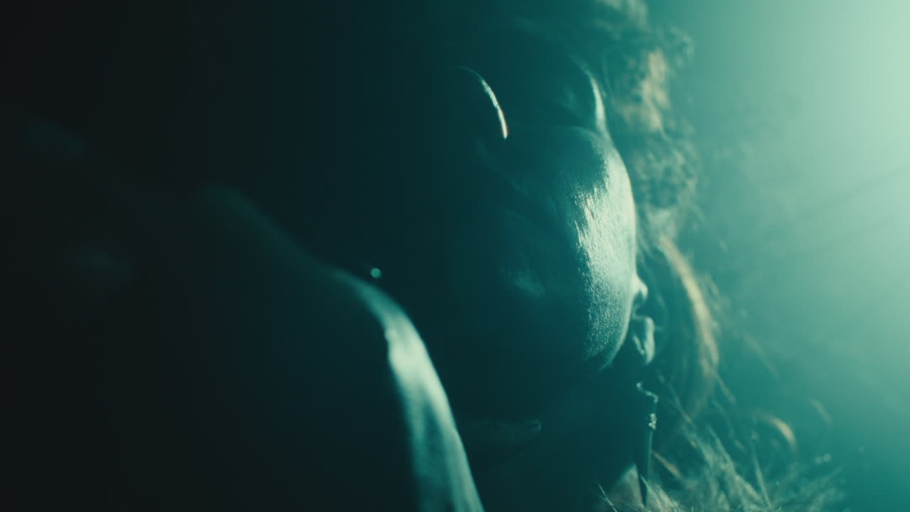 The witch makes a gesture of cutting her throat