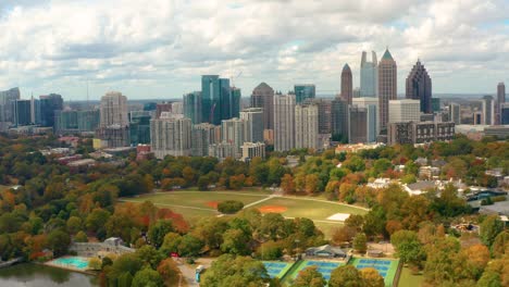 Aerial-shot-flying-towards-downtown-Atlanta-Georgia-and-Piedmont-Park-in-Fall