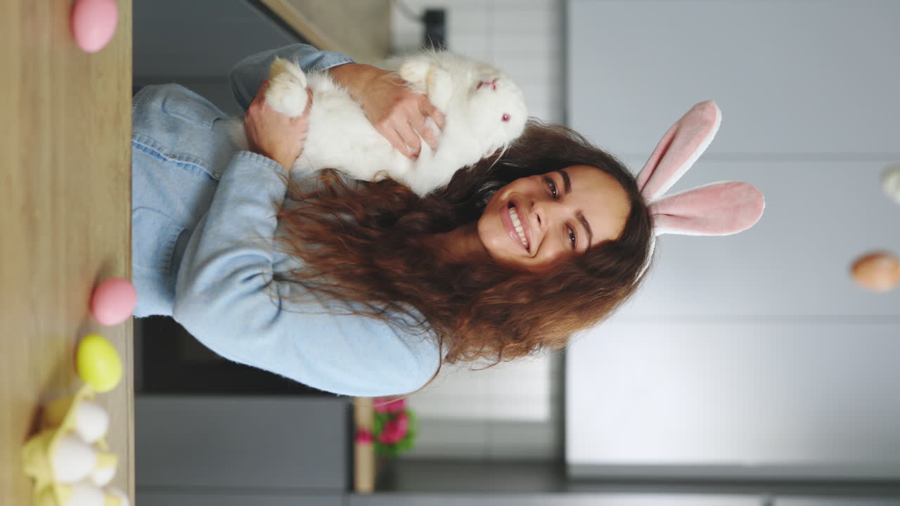 Woman with a Bunny in Kitchen at Easter