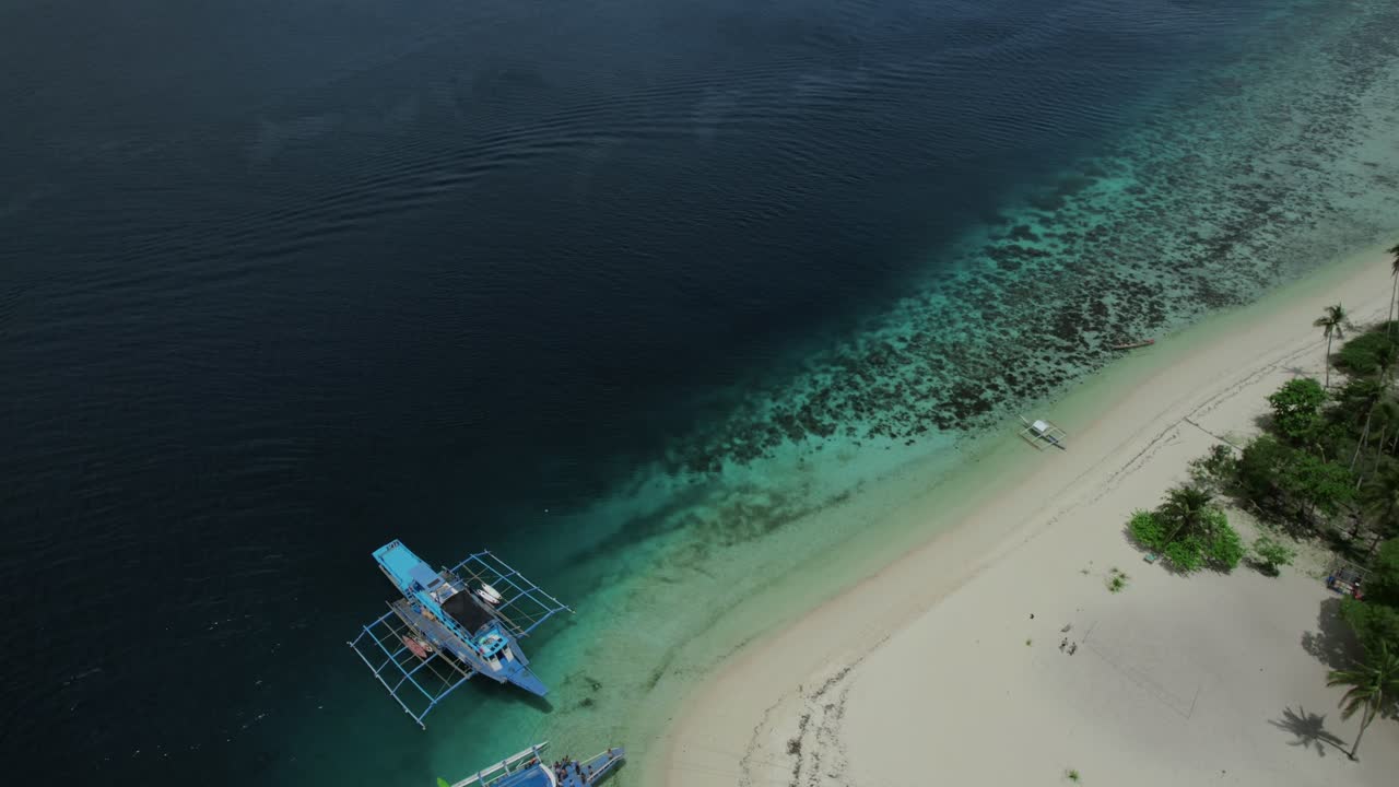 Aerial View of a Tropical Island Beach with Boats