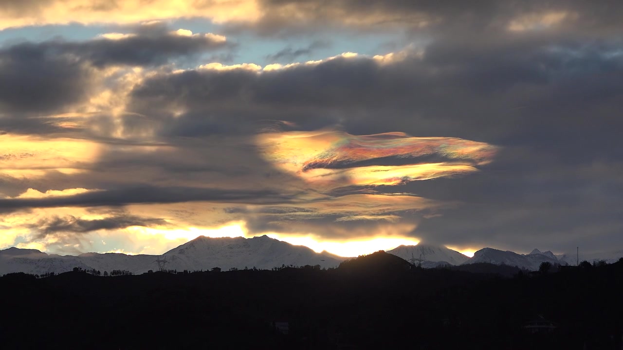 Dramatic Sunset Over Snow-Capped Mountain Range