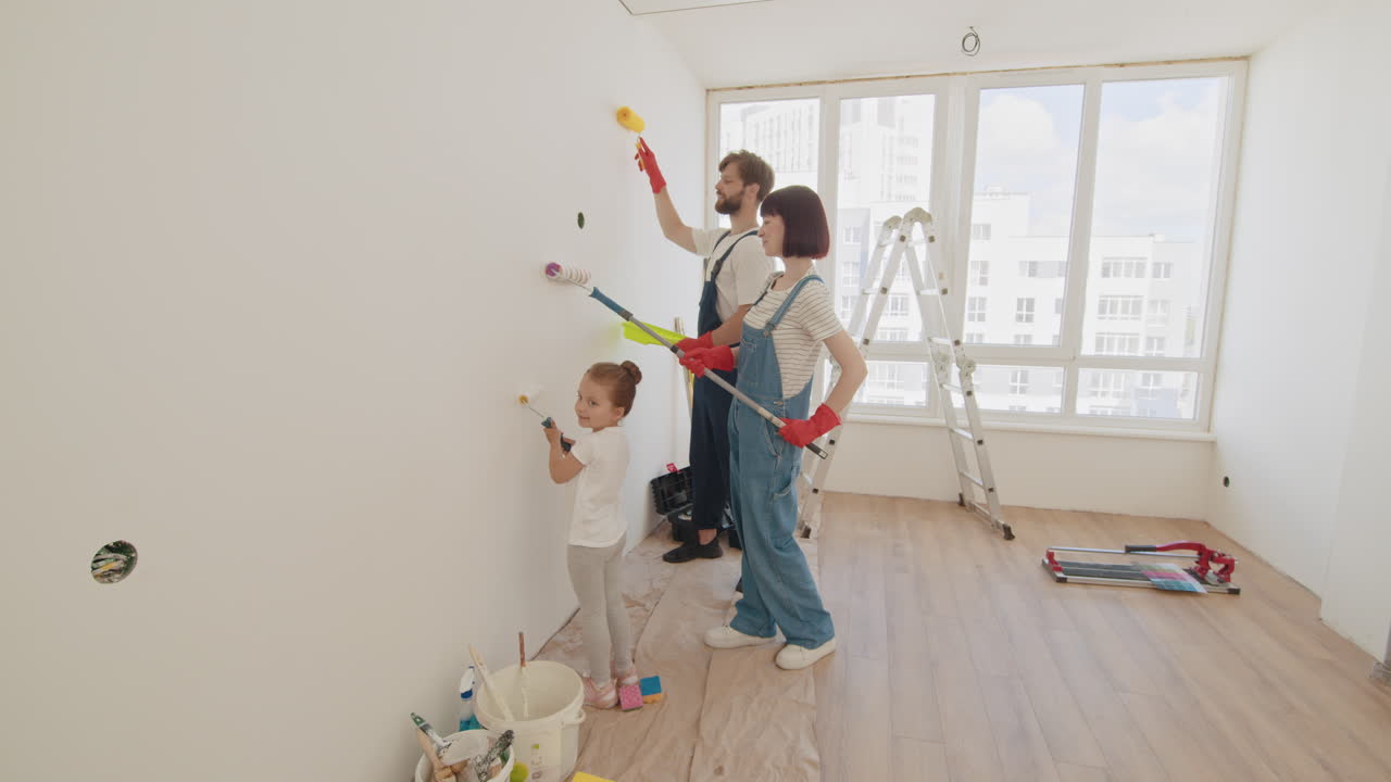 Family Painting a Wall Together