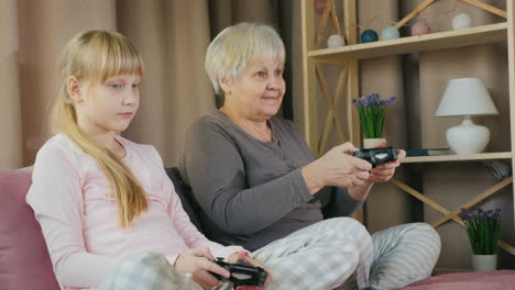 grandmother and granddaughter play video games together 4