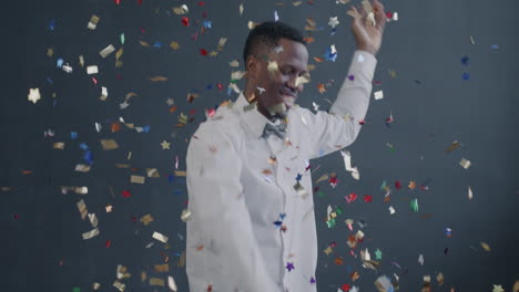 man celebrating with confetti