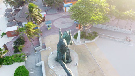 Aerial-view-during-sunset-at-Playa-del-carmen-of-the-Mayan-Portal-Monument-in-the-Mayan-Riviera,-México