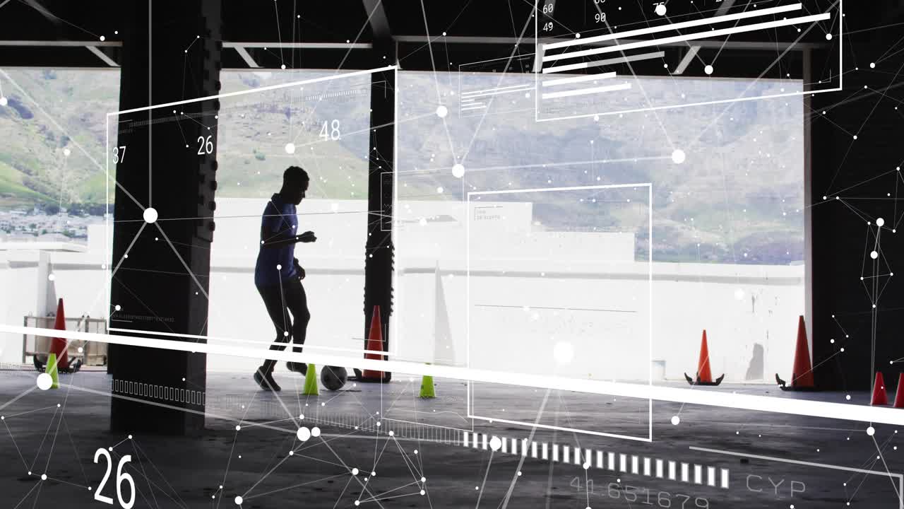 Male athlete approaching ball near green cone and starting sports training drill while HUD tracking