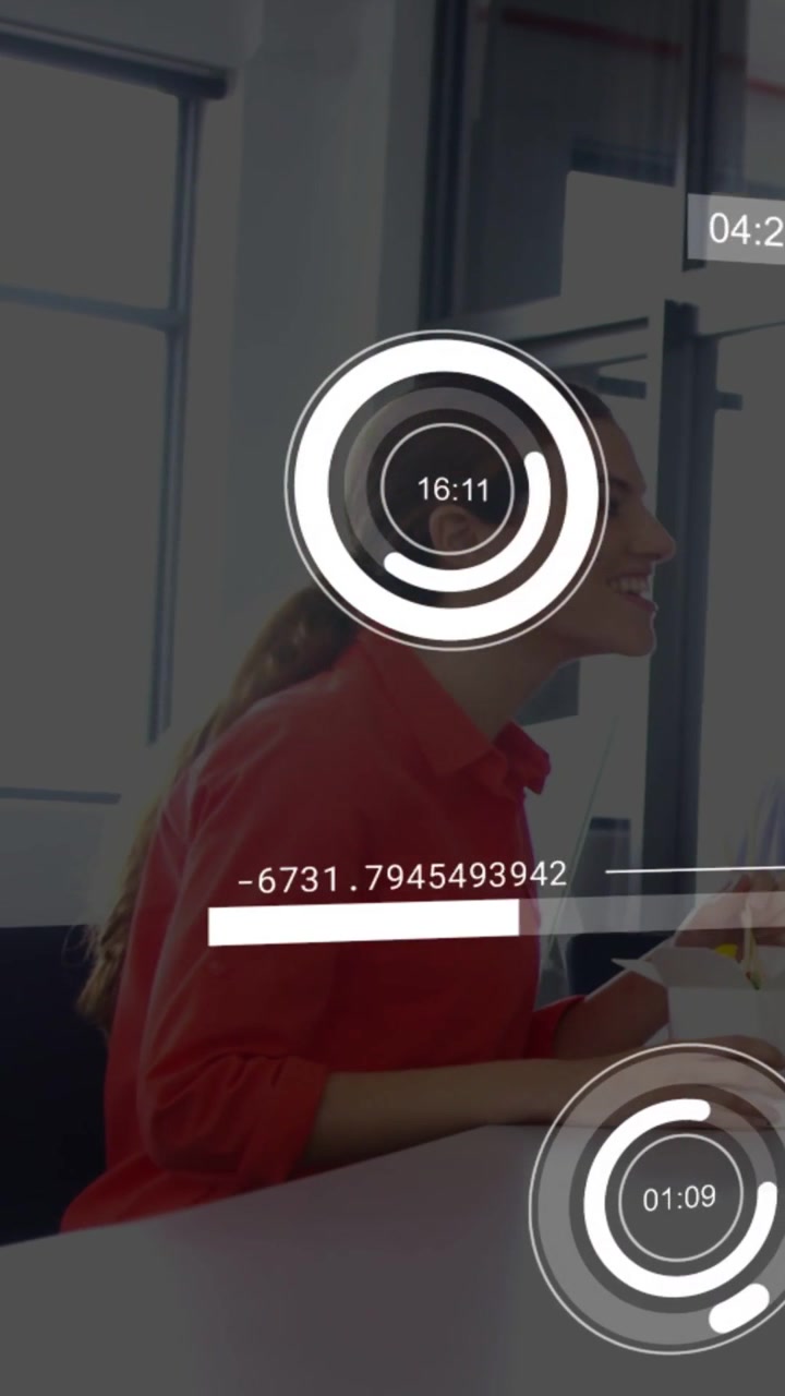 Vertical video: Woman in red blouse reaching cup, sparking office chat while AR HUD rings updating
