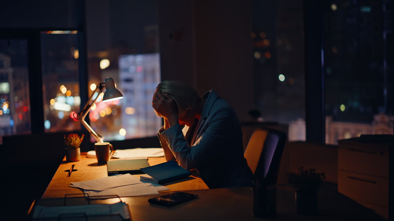 Overworked employee rubbing eyestrain late evening closeup. Woman workaholic
