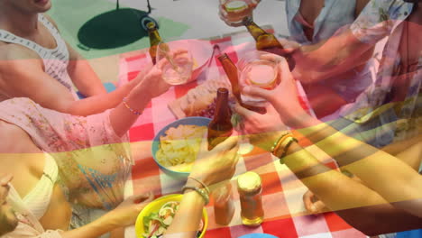 video compuesto de agitar alemania rica sobre diversos amigos brindando bebidas almorzando en el parque