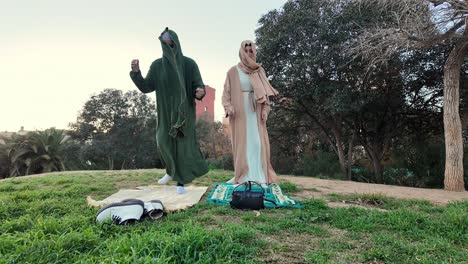 people praying in a park
