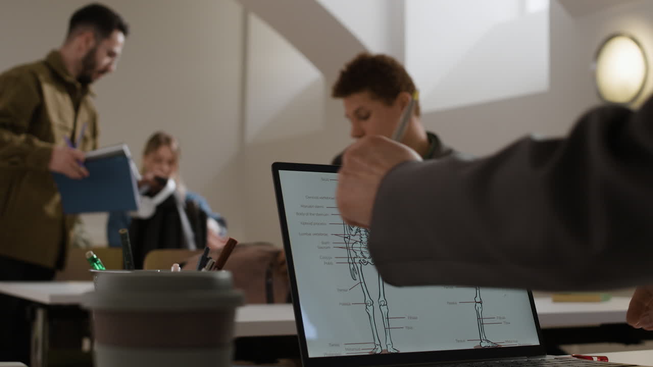 Classroom with anatomy diagram on laptop