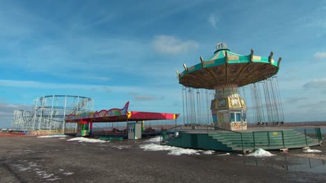 abandoned carnival rides at empty amusement park