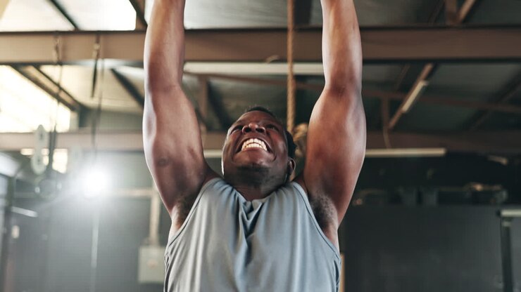 Gym, intense gymnastics and black man doing pull