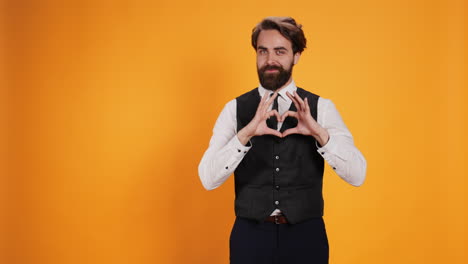 butler showing heart shaped symbol