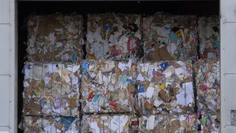 large bales of papers inside a recycling facility in dublin, ireland