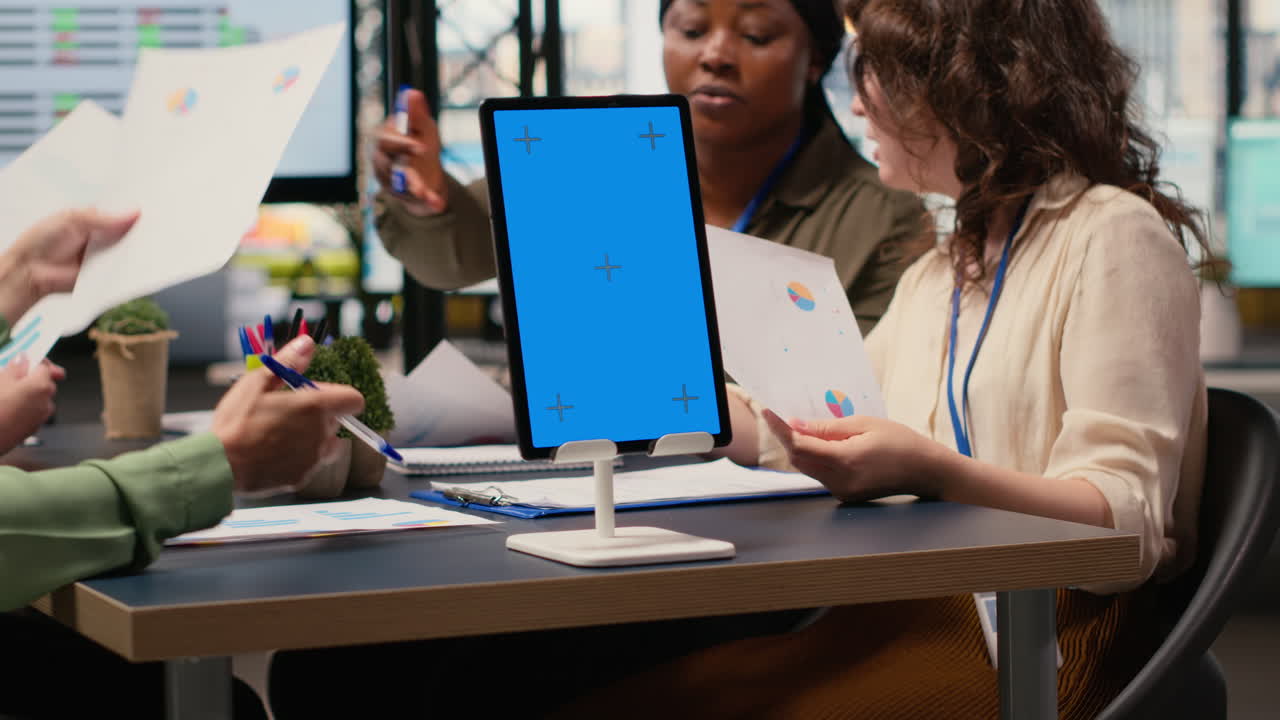 Vertical Video Businesswomen use a copy space display and charts to pitch career vision