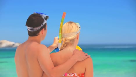 Cute-couple-wearing-snorkels-and-masks-